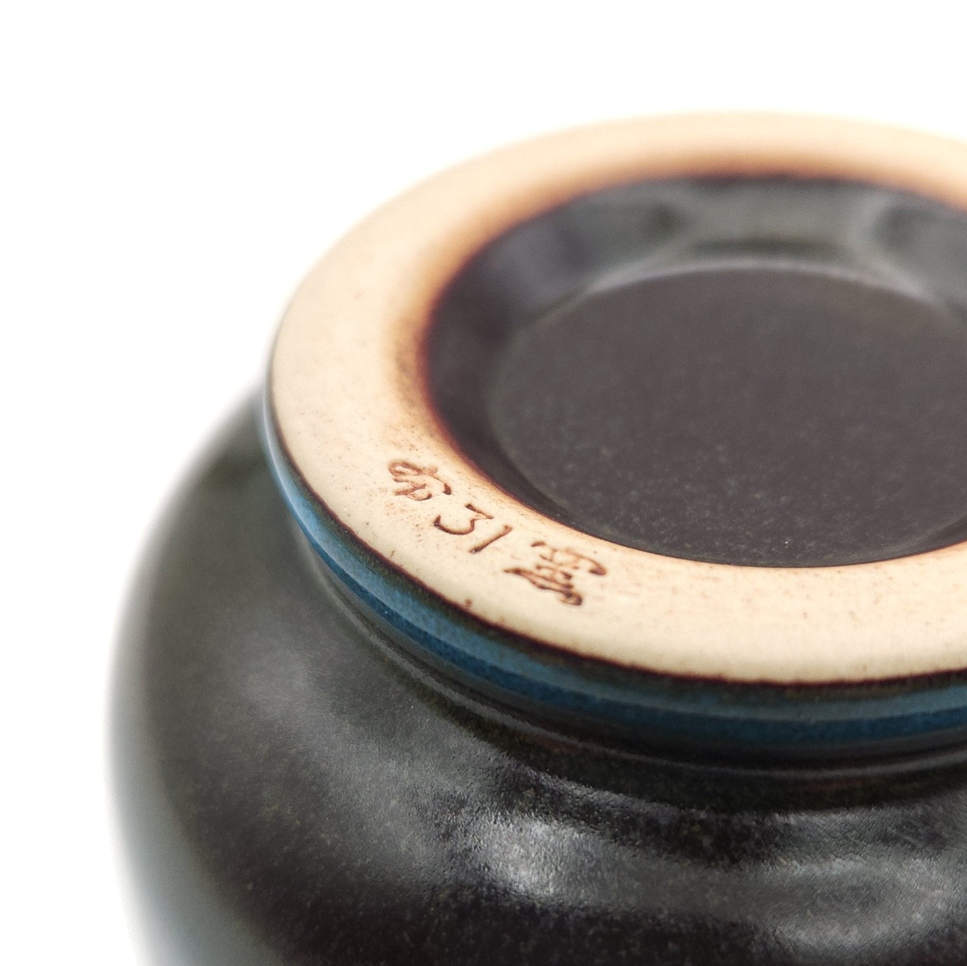 Authentic Japanese pottery teacup with tree pattern decoration. blue color. (bottom view 2).