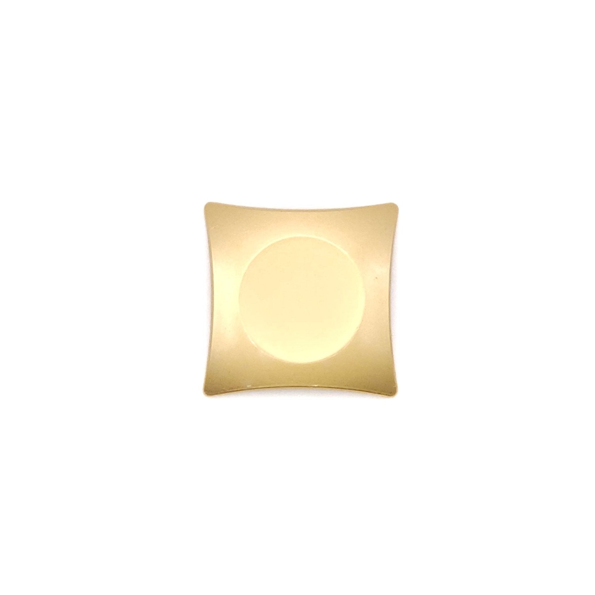 A Japanese Chopsticks rest in golden metal, bottom view.