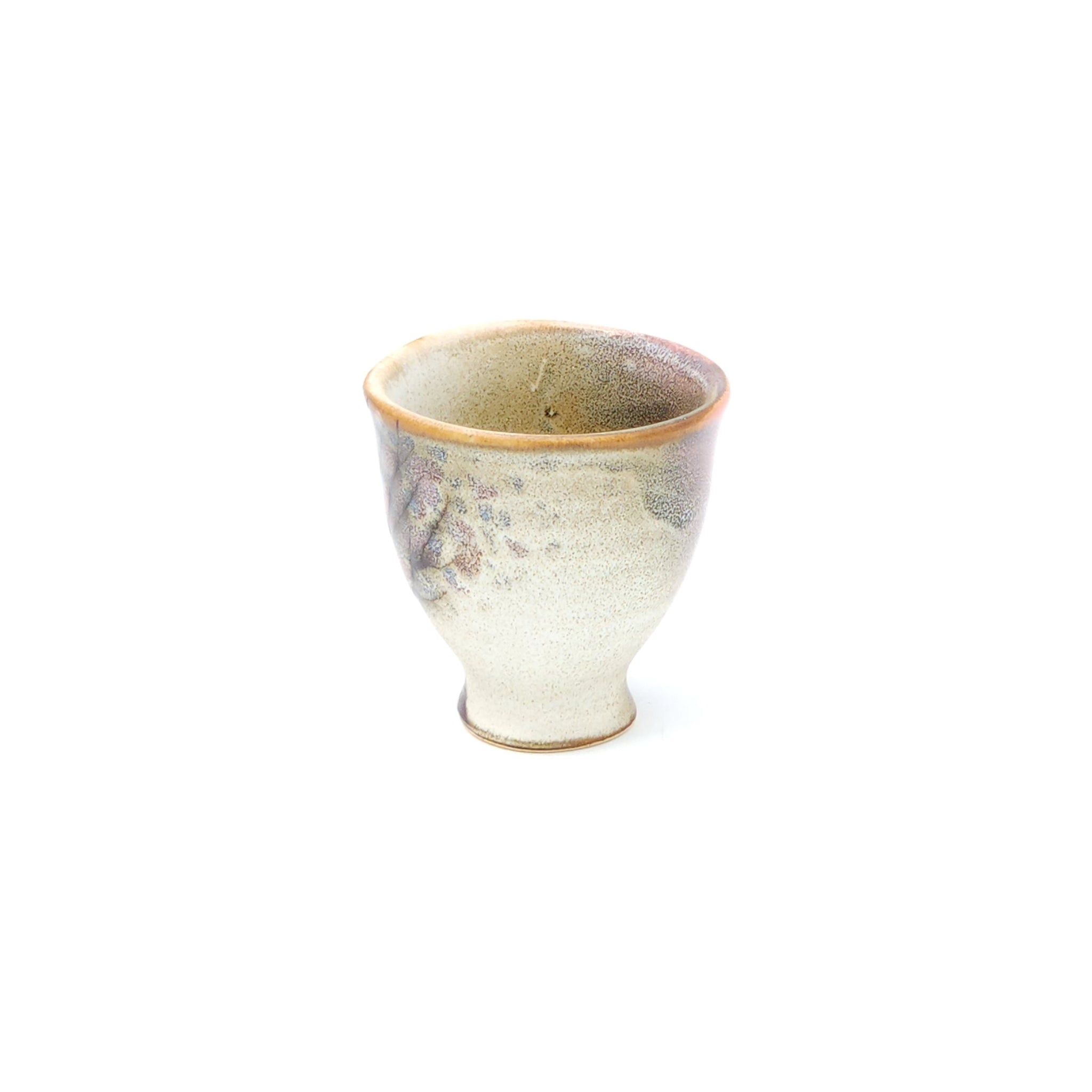A Japanese ceramic Conical Sake cup with a pink cherry blossom pattern. Tsukushi