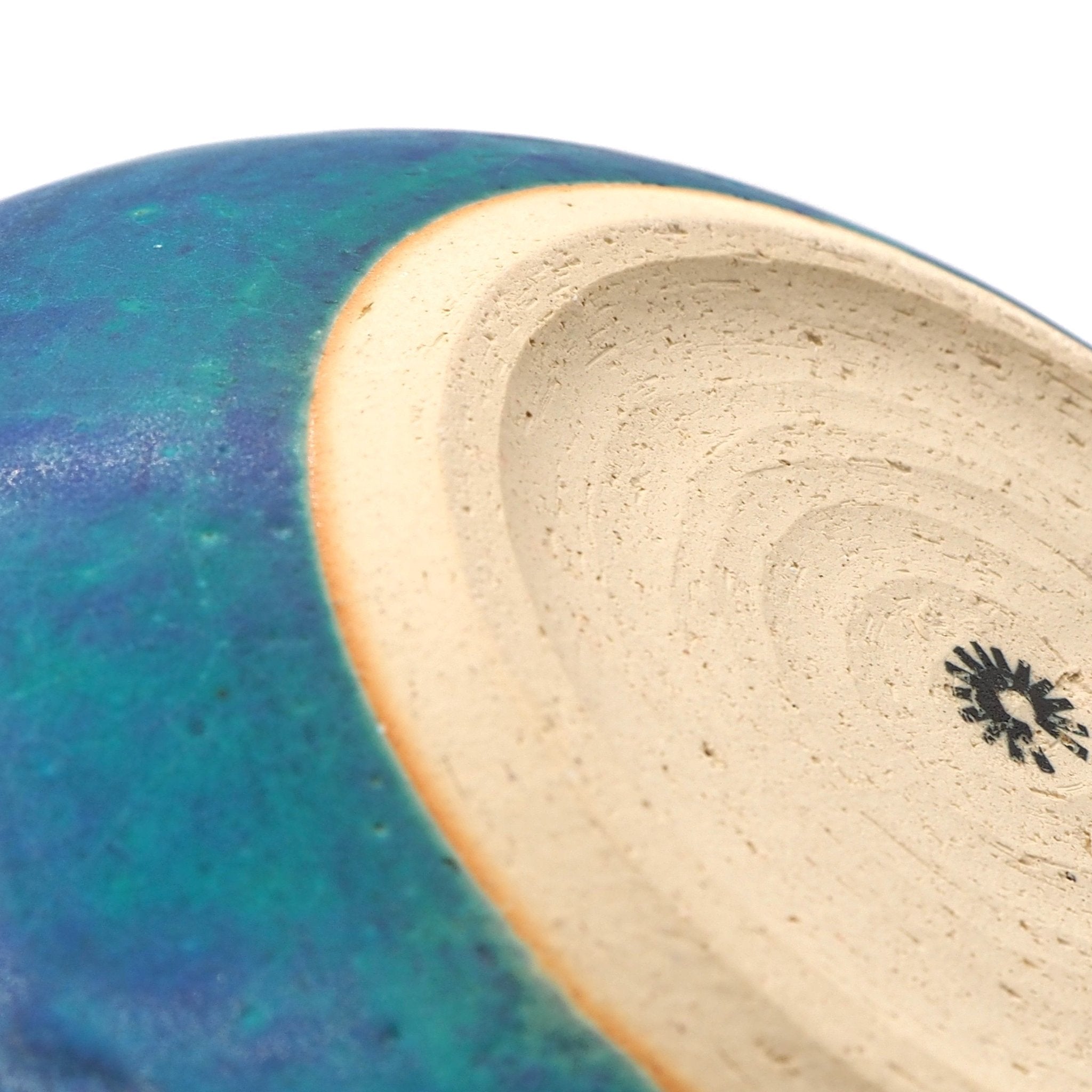Bottom detail of a turquoise Japanese pottery serving bowl 2