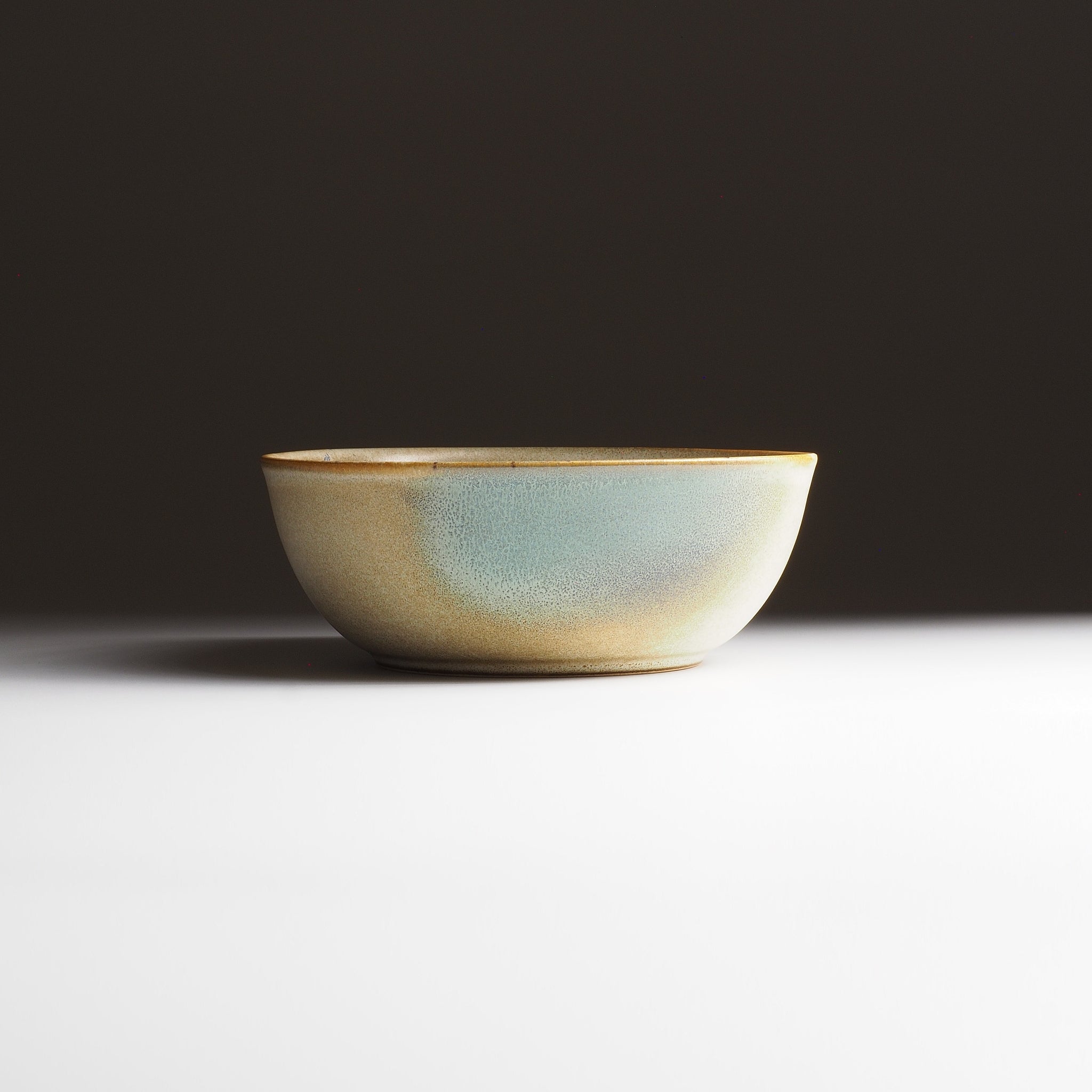 Ceramic bowl with a gradient finish on a dark background