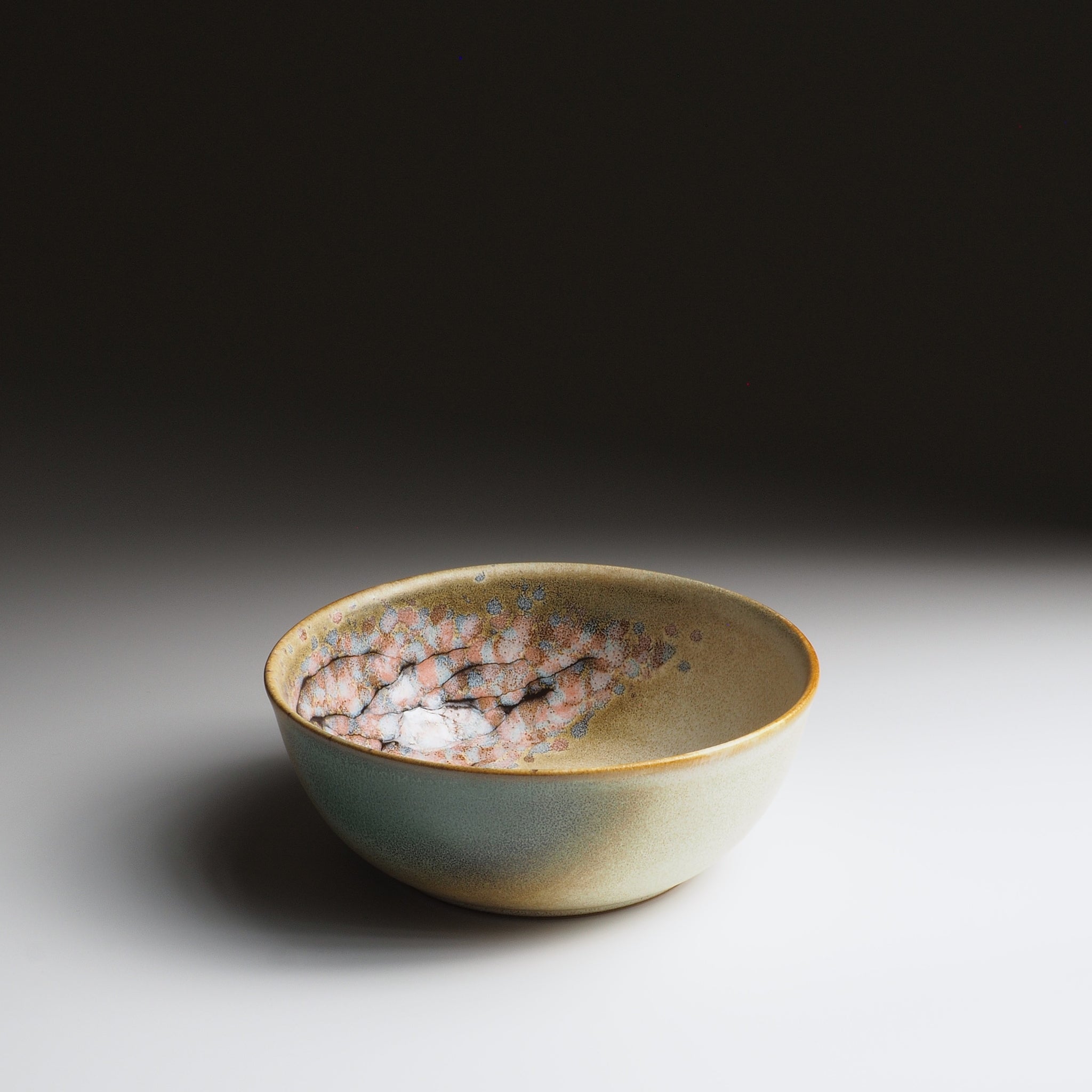Harukaze Japanese green salad bowl by K.Kojima. Front view on gradient background.