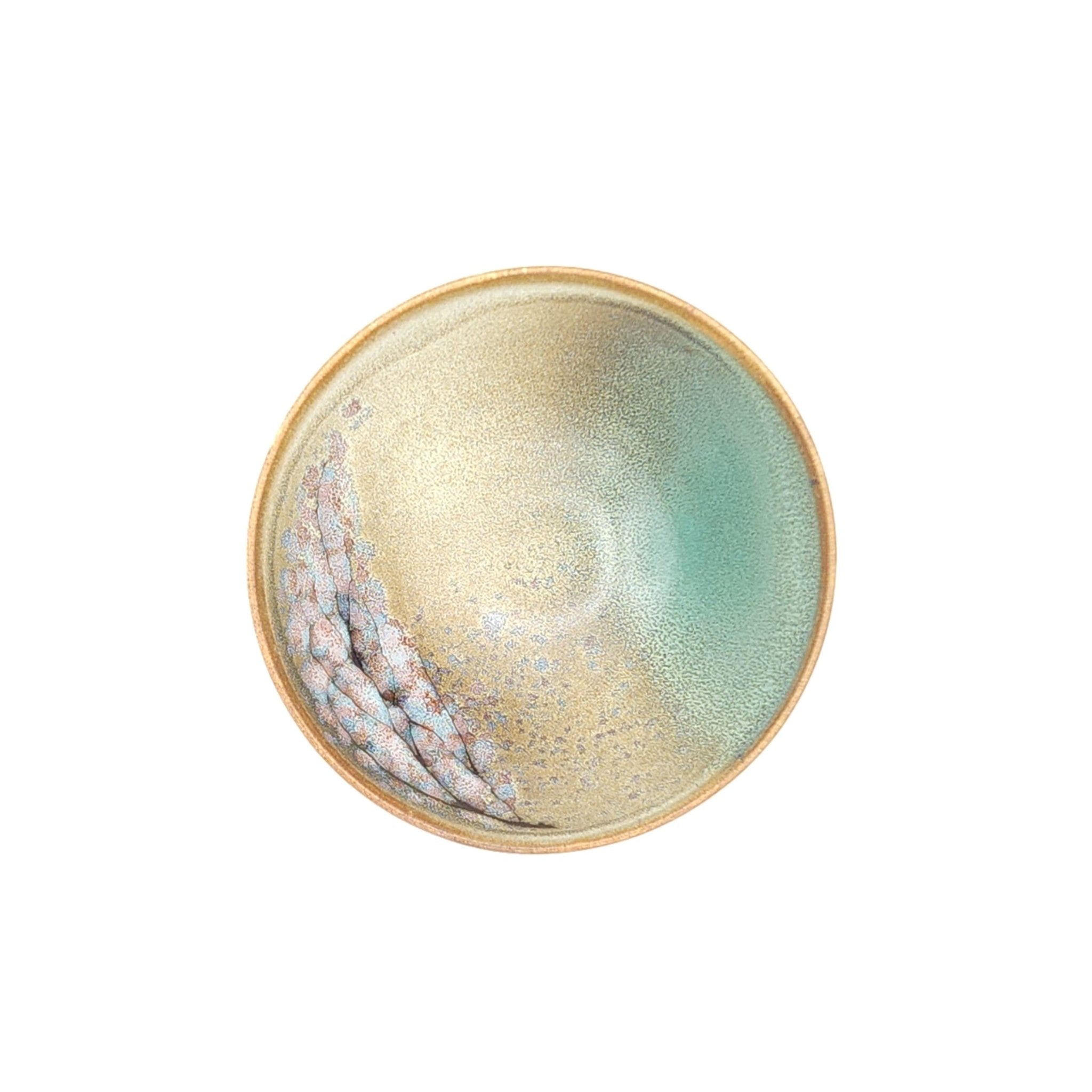 Authentic Japanese pottery bowl with cherry blossoms decoration. Green and beige color. (top view 1).