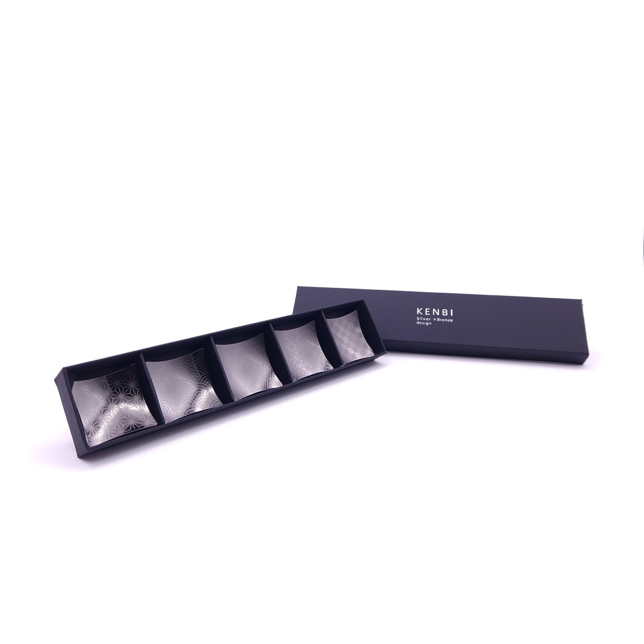 5 Japanese Chopsticks rests in black metal inside a box
