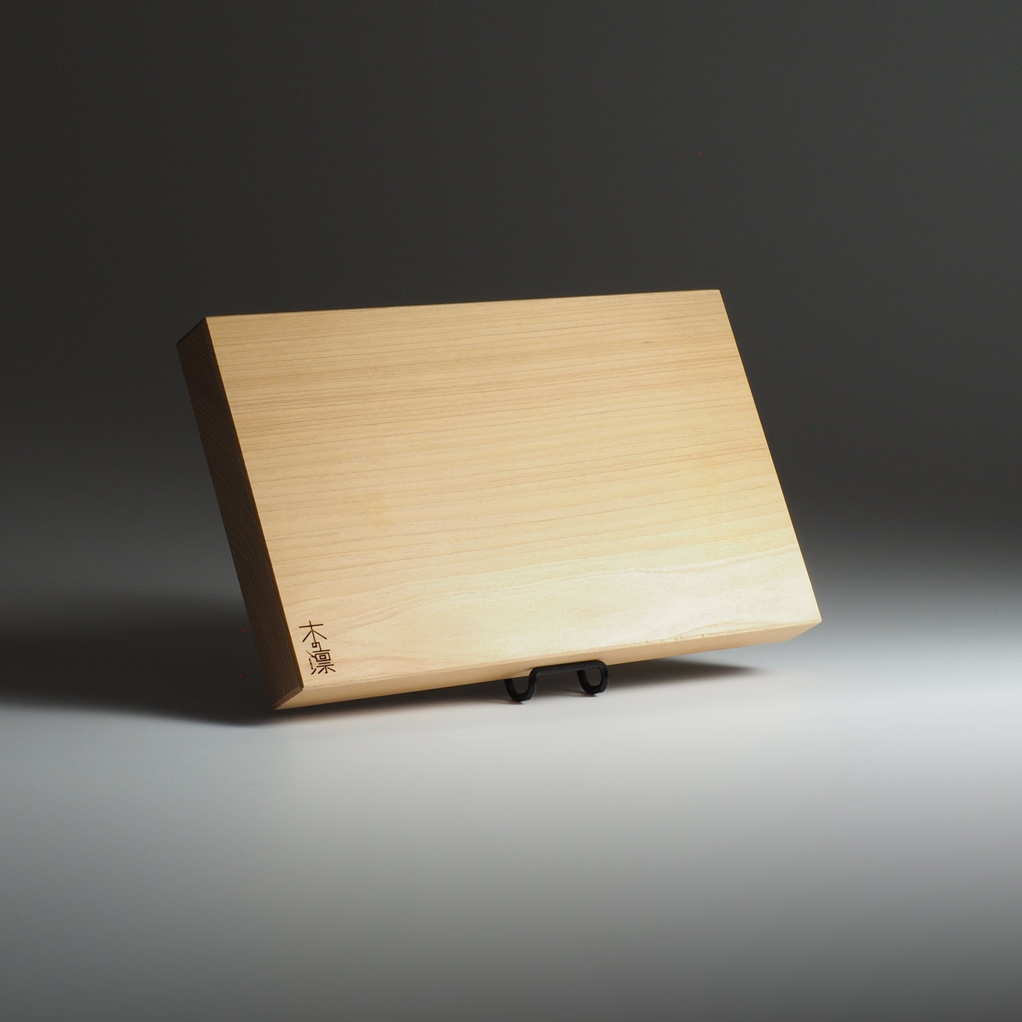 Manaita wooden cutting board on a dark background