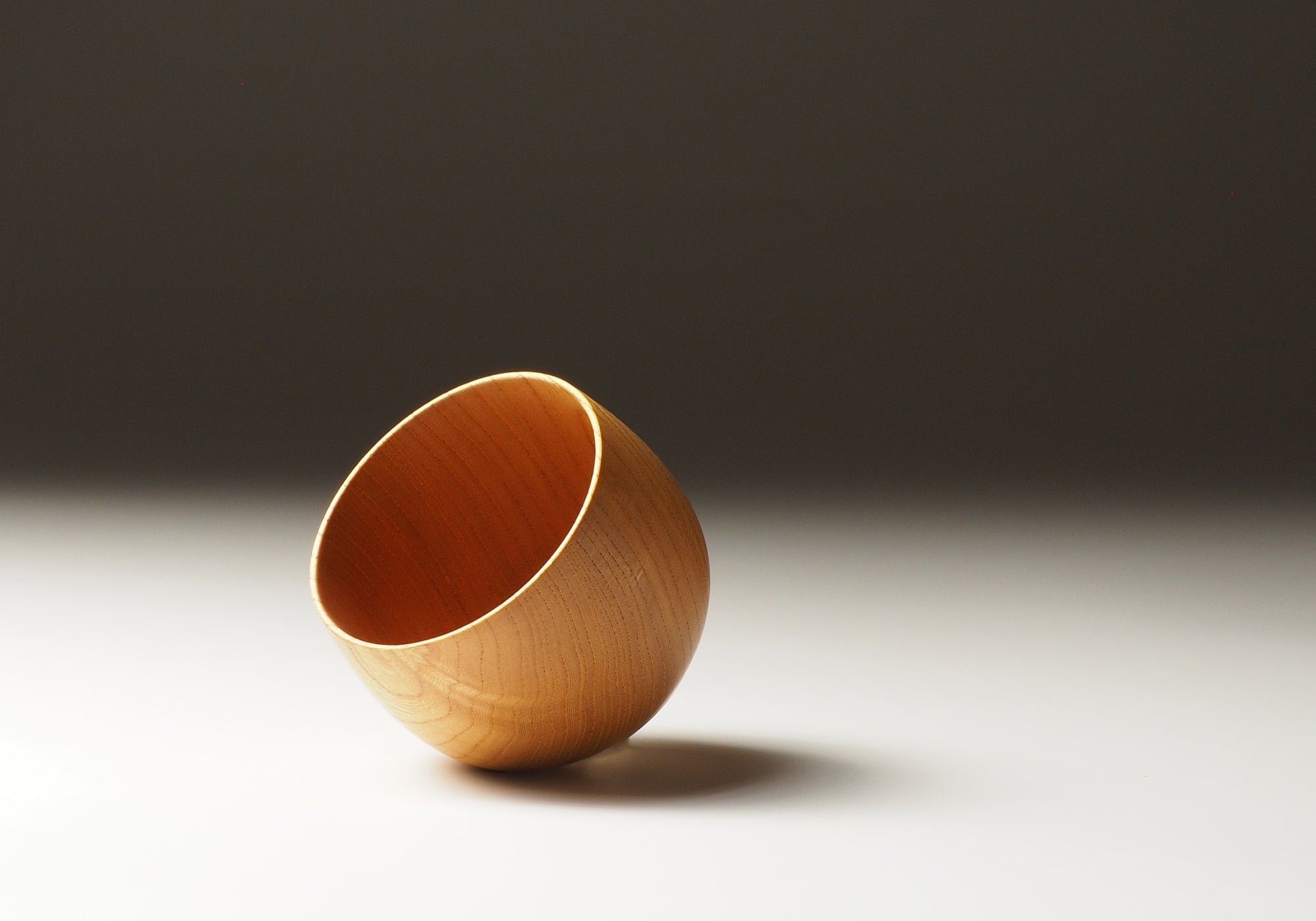 A inside view of a Japanese wooden yunomi cup on a natural background. Tsukushi 