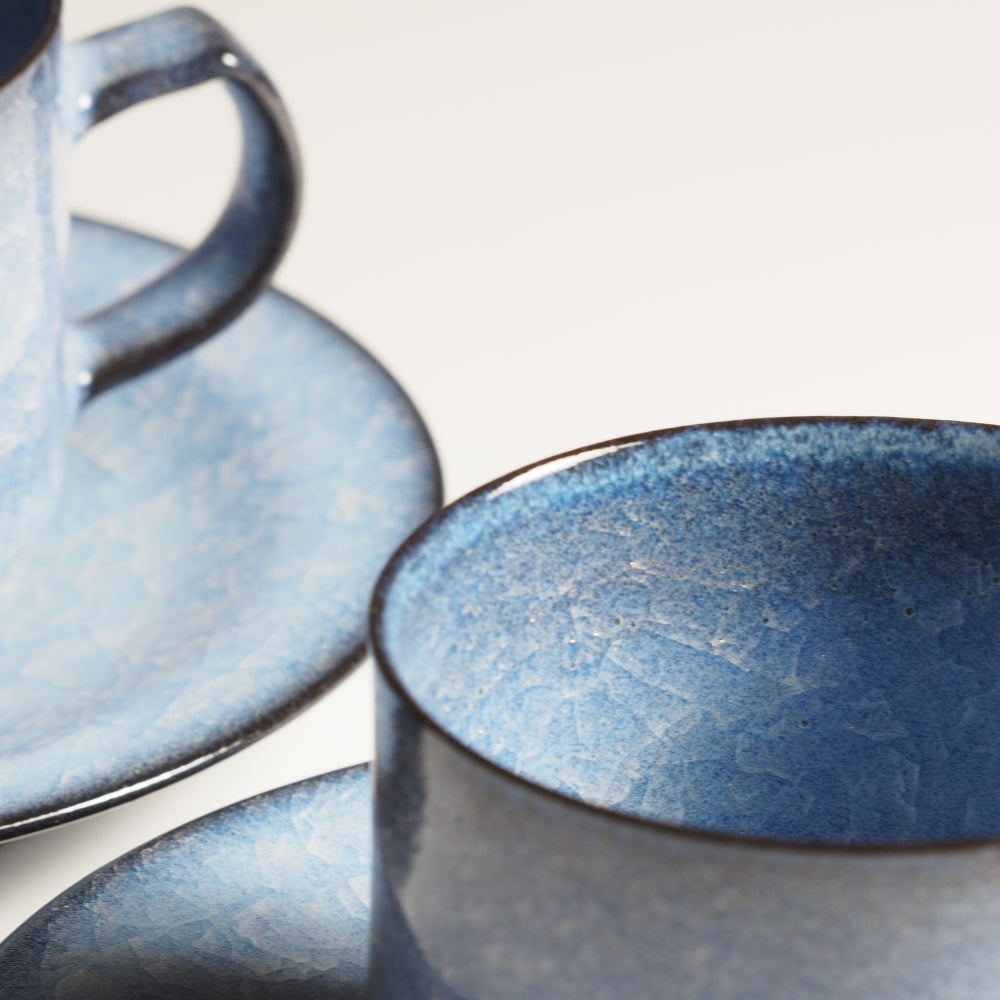 Handcrafted crazing Japanese ceramic coffee cups and saucers white background, Tsukushi