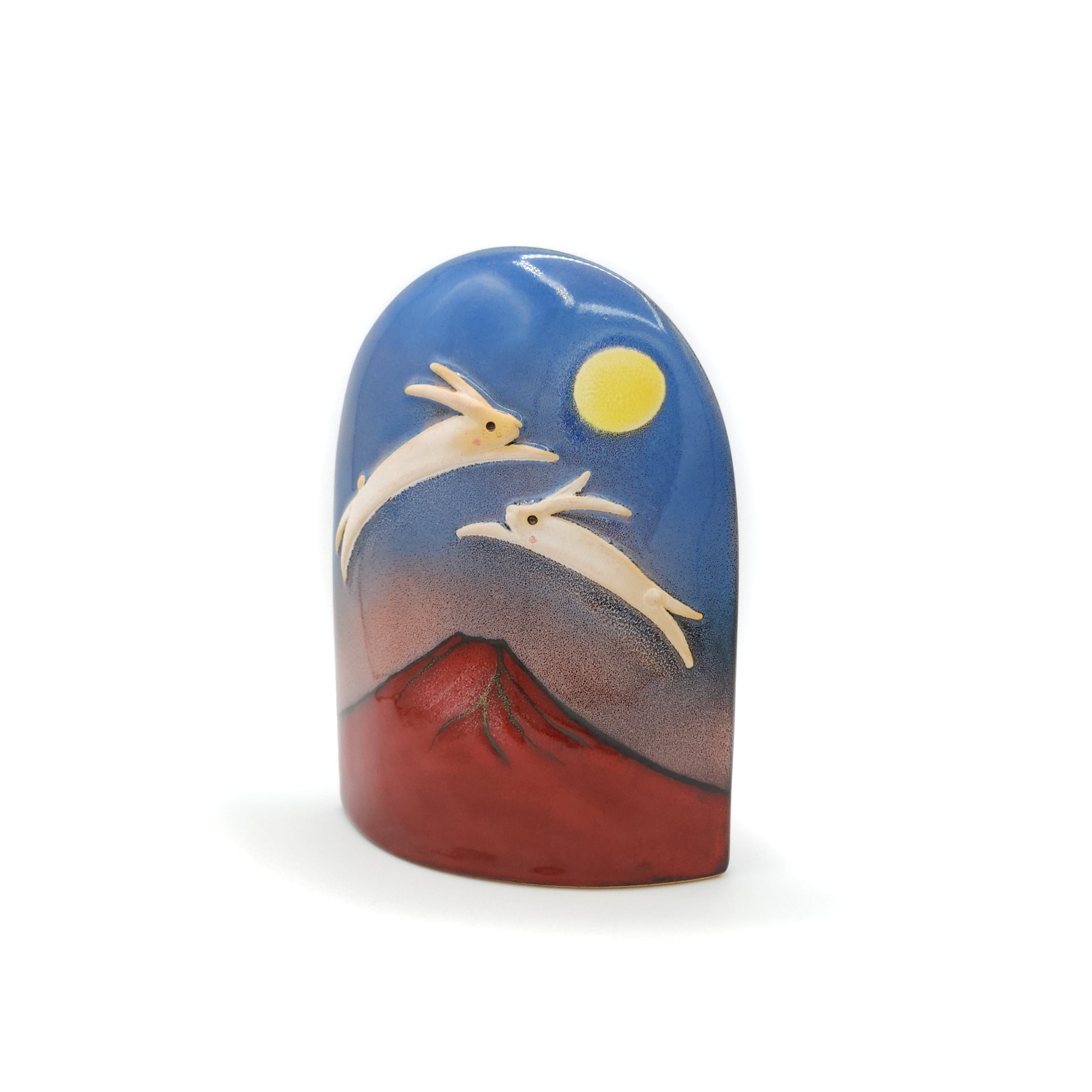 Front view of a Japanese pottery ornament with Red Mt.Fuji, dancing rabbits and full moon.