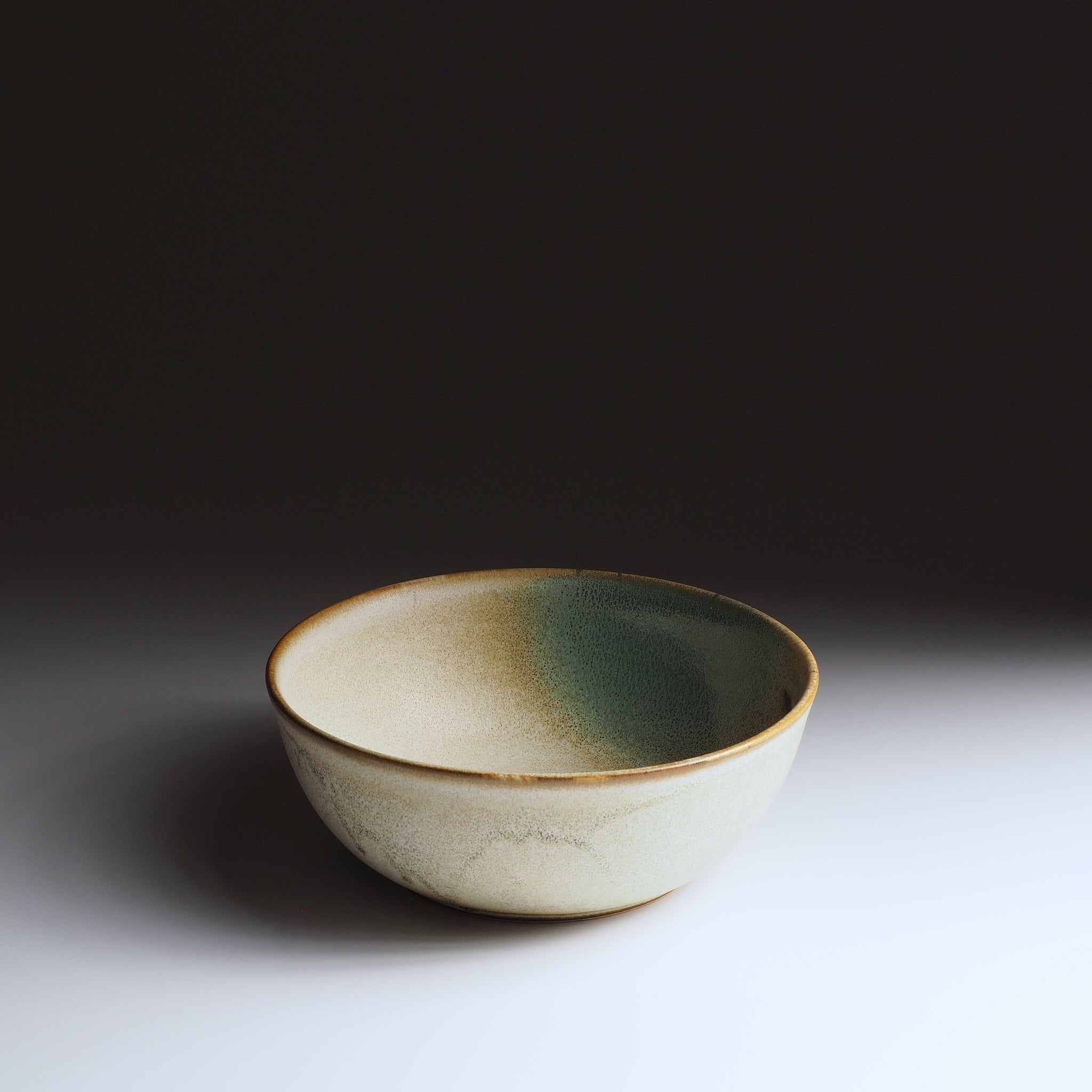 3/4 front view of the Harukaze Japanese Salad green bowl by artist Kazuhiro Kojima