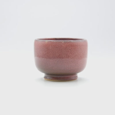 Video of a dark pink Japanese Pottery Teacup.