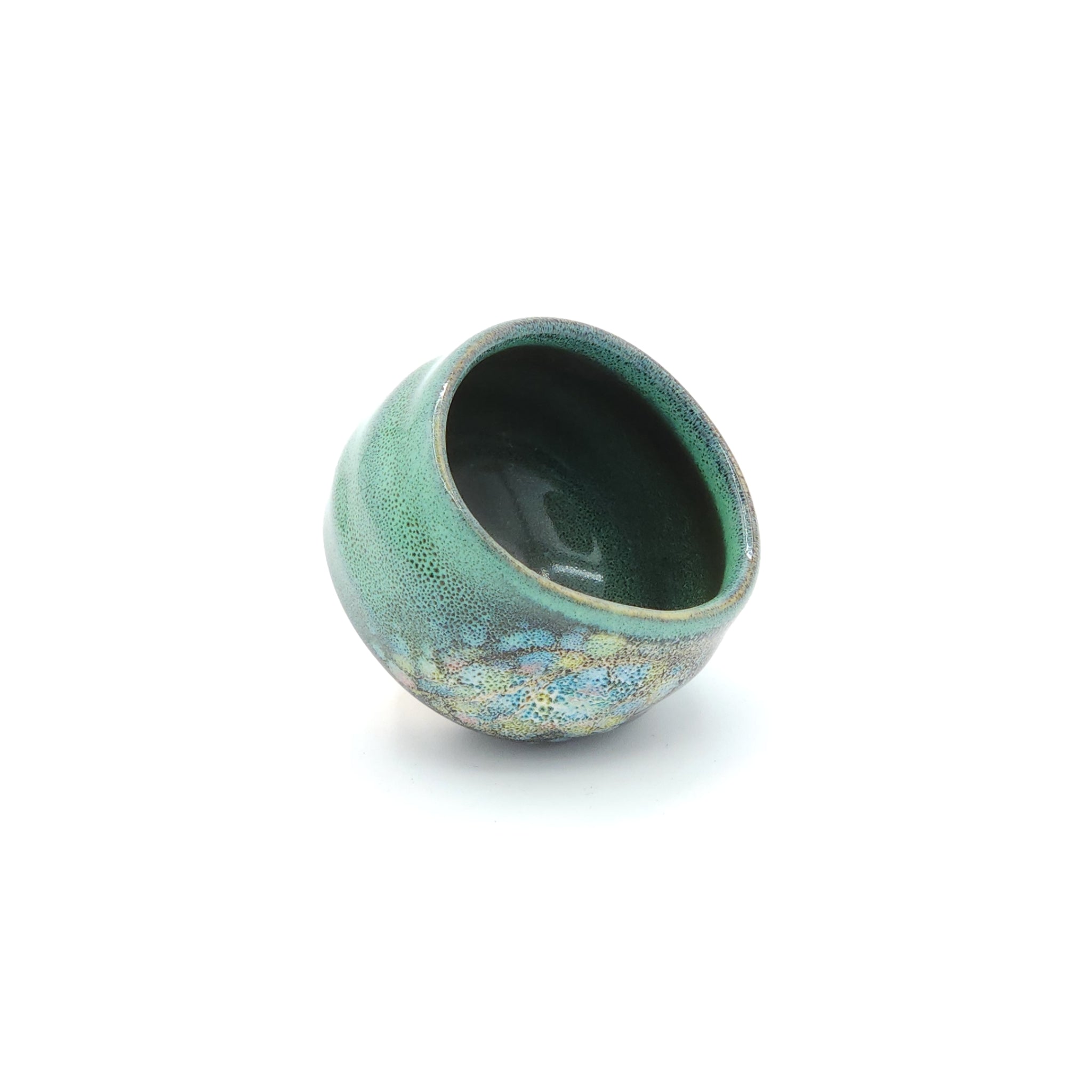 A side view of a Green Japanese round sake cup. Tsukushi